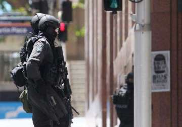 sydney cafe seige victim reportedly shot dead by police