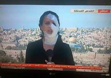 injured by a grenade this journalist reported live wearing bandages watch video