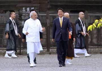 pm modi arrives in tokyo to hold summit talks with abe