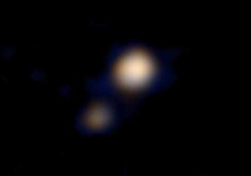 nasa reveals first ever colour image of pluto