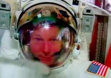 spacewalking astronaut safe after water leaks into helmet