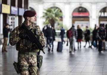 brussels on high alert as police hunt paris attack fugitive