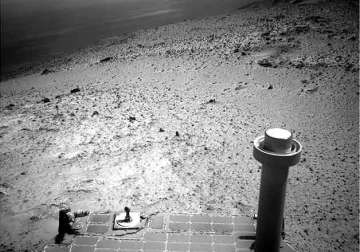 opportunity rover takes in view from top of martian hill