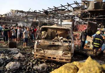 truck bombing at baghdad market kills 67 islamic state claims blast