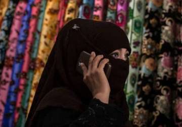 xinjiang province in china bans wearing of burqa by muslim women