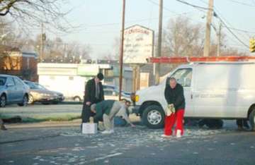 motorists scramble to collect dollars as security van drops cash