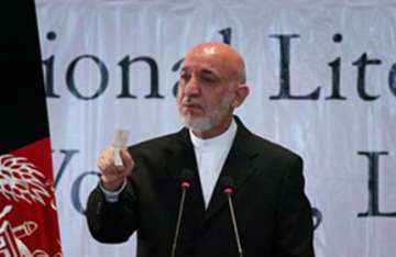 karzai tearful as bombing kills afghan official