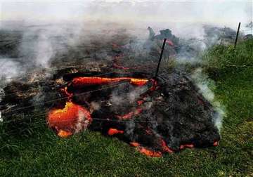 in pics red hot lava nears hawaii home and main road