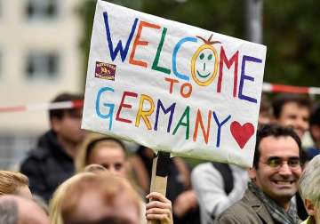 germany demands eu partners share burden of migrant influx