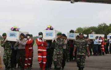 airasia crash rescuers find 30 bodies focus on 5 sq km area