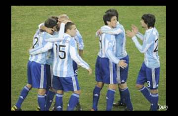 tevez double puts argentina into last eight