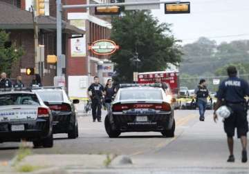 gunman attacks dallas police headquarters with automatic weapons bombs