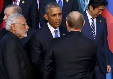 barack obama putin huddle on sidelines of g 20 summit