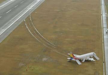 asiana passenger plane skids off runway in japan 22 injured