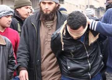 horrific pics isis amputates man s hand for theft whips 3 for drinking publicly crucifies a spy