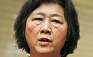 china party paper backs charges against journalist