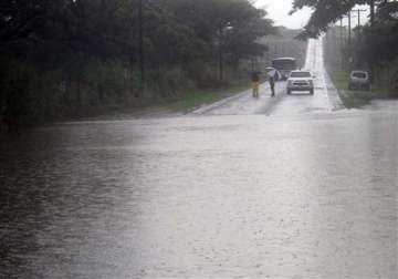 hawaii hit by winds rain as hurricane veers west