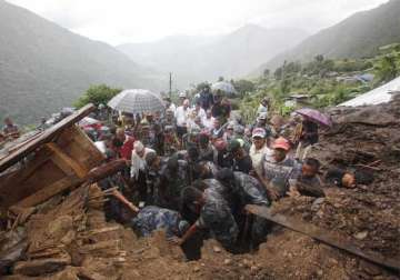 landslides bury nepal villages killing at least 30 people