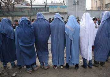 afghan men march donning burqas in support of women s rights