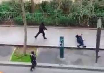 charlie hebdo shooting 1 suspect surrenders hunt on for remaining 2