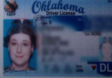 woman wears colander for driver s license photo