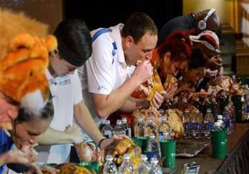 joey chestnut devours turkey to win eating contest