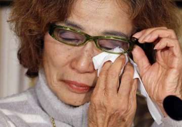 mother of is held japanese hostage calls for release of son