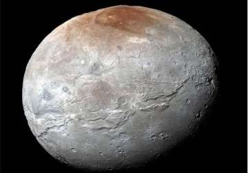 nasa releases pluto s moon charon in eye catching detail