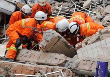 9 storey building collapses in china 16 people missing