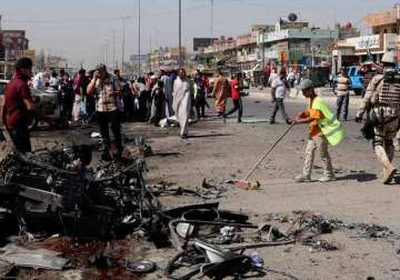 iraq officials huge truck bomb in baghdad market kills 54