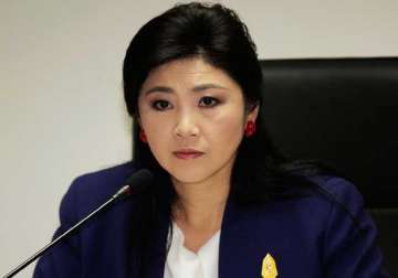 former thai pm shinawatra faces corruption charges