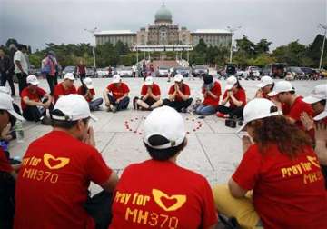 as world moves on mh370 families find solace in each other