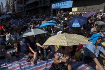hong kong protesters threaten to occupy buildings
