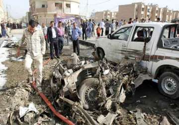 bombs in iraq including twin blasts on busy street kill 23