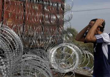 refugee crisis hungary declares emergency seals border detains migrants