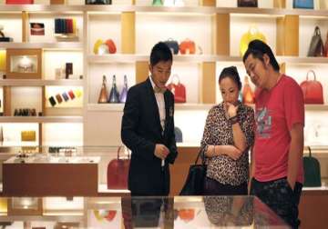 china buys half of all luxury goods report