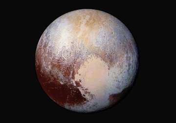 conditions on pluto incredibly hazy with flowing ice