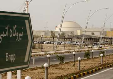 defiant iran loads indigenous fuel rods into reactor