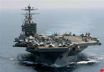 iranian boats shadow us aircraft carrier in gulf