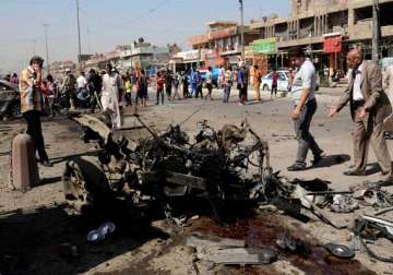 iraq bombings house raid kill at least 80 people