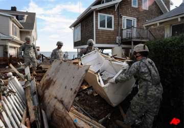 irene s death toll rises to 46 u.s. towns battle floods