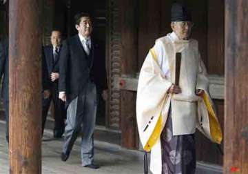 japanese pm visits war shrine angering china and south korea