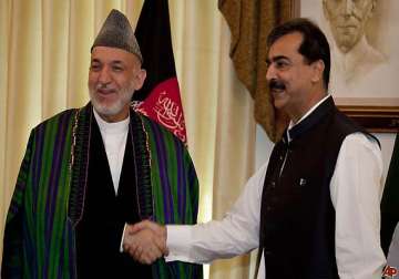 karzai calls gilani asks him to reconsider bonn boycott