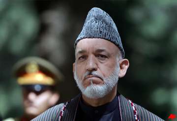 karzai reviewing taliban peace strategy spokesman