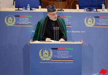 karzai will try to hold on to power beyond 2014 report