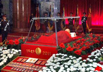 kim jong il body displayed north korea media hail son