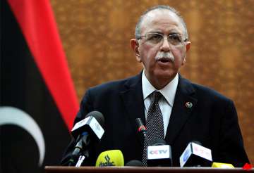 libya s new pm balances demands of ex rebels west