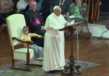 little boy sits in pope s chair steals the show