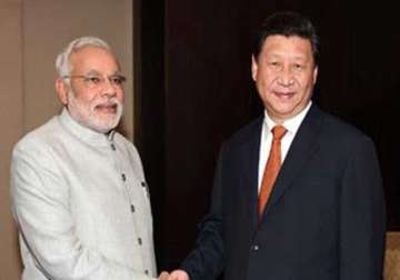 narendra modi meets xi jinping wants to solve border row seeks investment