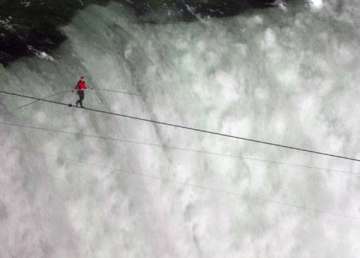 nik dares to break record walks across niagara falls